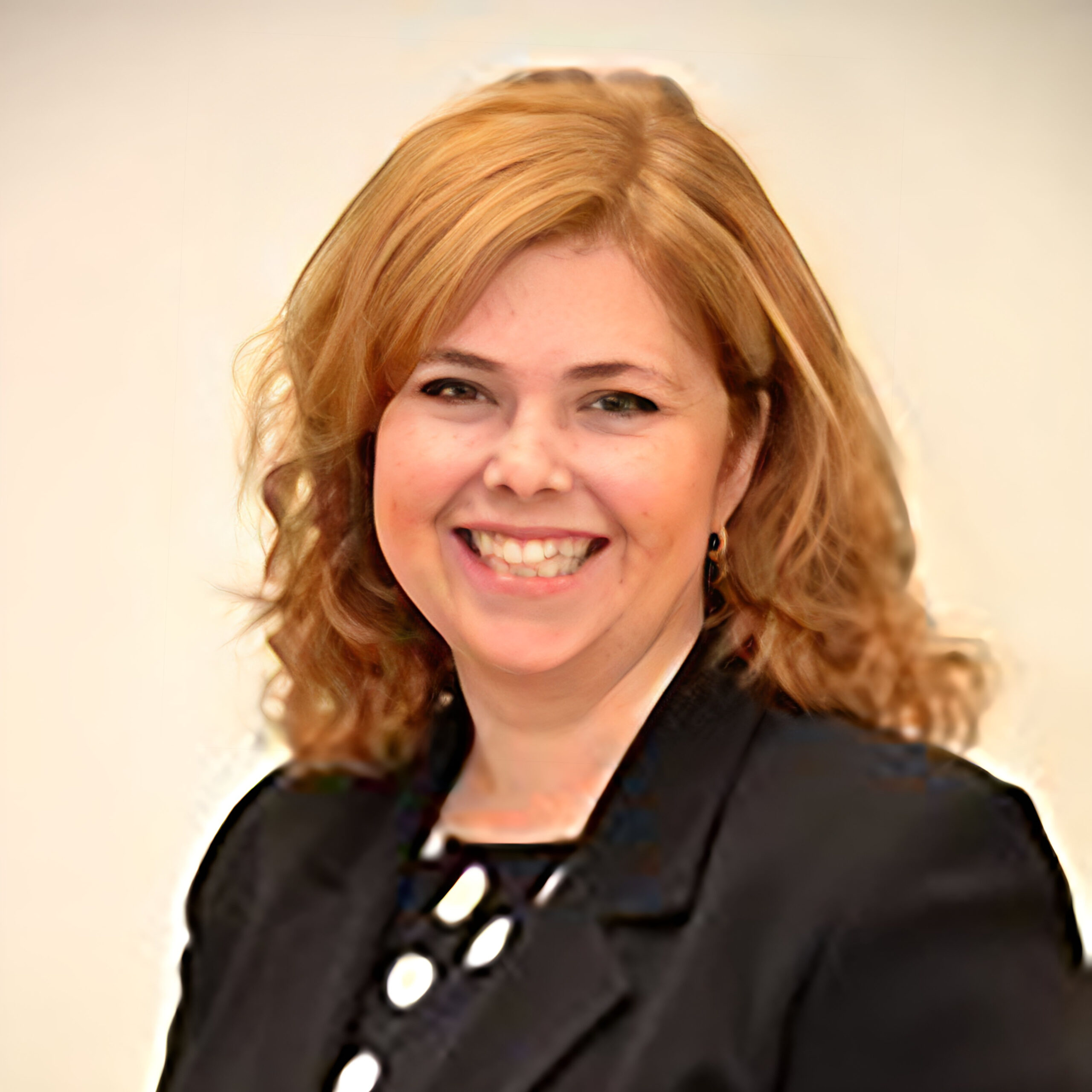A woman smiling at the camera
