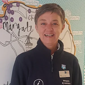 Lady stood in front of map image