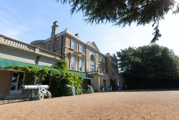 Front exterior view of Quex House. Gravelled front, cannons in front of windows,