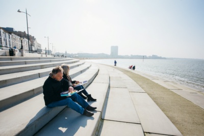 Older-couple-having-fish-and-chips-on-Margate-Steps.-Credit-@VisitThanet